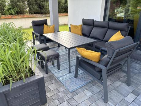 Aluminiowy zestaw ogrodowy z wysokim stołem, sofą 202cm, fotelami i pufami Renalo Dining Grafitowy