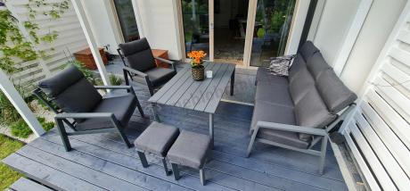 Aluminiowy zestaw ogrodowy z wysokim stołem, sofą 202cm, fotelami i pufami Renalo Family Grafitowy