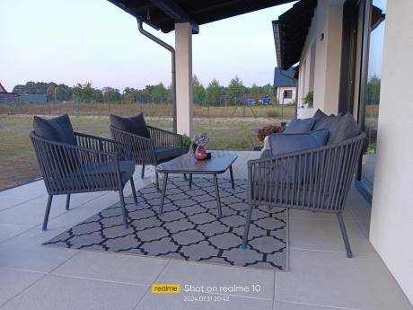 Antracytowe nowoczesne meble ogrodowe metalowe rope style z sofą, fotelami i stolikiem kawowym Kostto Cafe