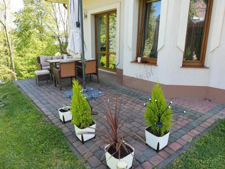 Brązowe meble technorattanowe z wysokim stołem 120cm i sofą Torino Dining