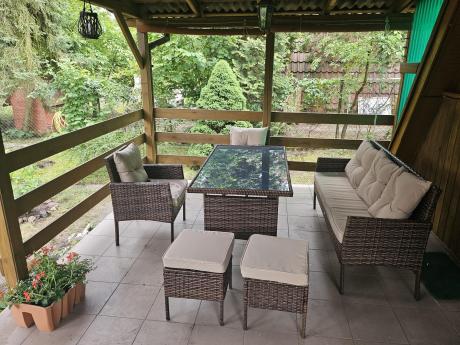 Brązowe meble technorattanowe z wysokim stołem 120cm i sofą Torino Dining