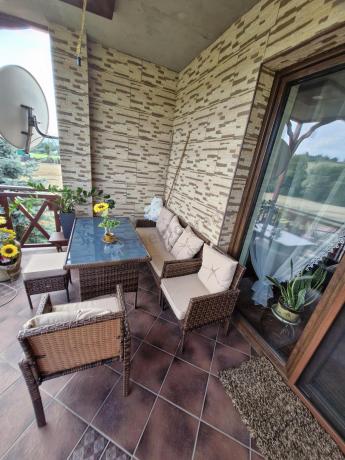 Brązowe meble technorattanowe z wysokim stołem 120cm i sofą Torino Dining