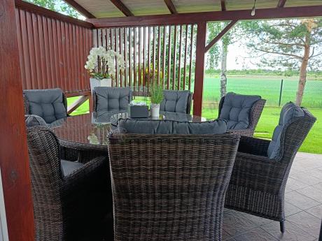 Brązowy zestaw mebli obiadowych na taras Laritto 8+1 okrągły stół - technorattan