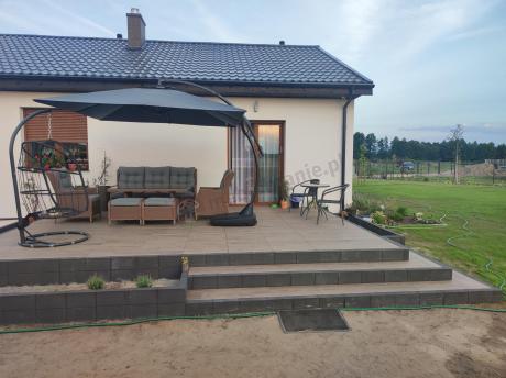 Brązowy zestaw technorattanowy tarasowy Laritto Dining + pufy - Brown