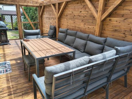 Duży narożnik ogrodowy metalowy 294x184cm Doros Corner XXL z 2 fotelami, 2 pufami i stołem 160cm - Polywood Dark Grey