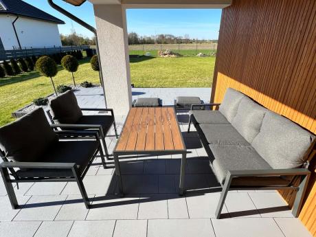 Grafitowy zestaw mebli metalowych na taras Sodor Dining + pufy - Dark Grey Polywood