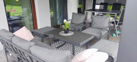 Grafitowy zestaw mebli na taras - sofa 175cm, 2 fotele i 2 pufy - Panaon Dining DG