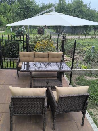 Meble ogrodowe z sofą 175cm, wysokim stołem, fotelami i pufami Perata Dining Brown
