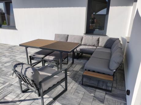 Metalowy narożnik ogrodowy 280x220cm ze stołem obiadowym i fotelem Panaon Grey Teak
