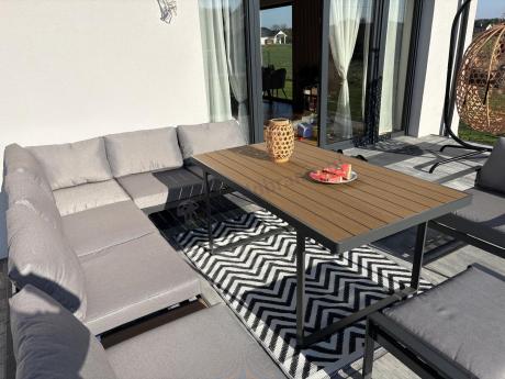 Metalowy narożnik ogrodowy 280x220cm ze stołem obiadowym i fotelem Panaon Grey Teak