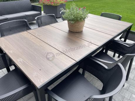 Nowoczesne meble obiadowe dla 10 osób do ogrodu Portis ze stołem 200cm i blatem w kolorze drewna