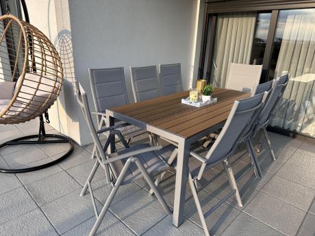 Szare meble ogrodowe - komplet stół i 8 regulowanych krzeseł - Kanbery Wood Silver 8+1