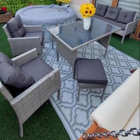 Szare meble ogrodowe technorattan ze stołem obiadowym i sofą Torino Dining