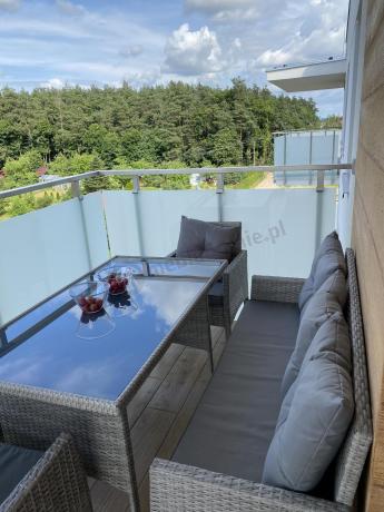 Szare meble ogrodowe technorattan ze stołem obiadowym i sofą Torino Dining