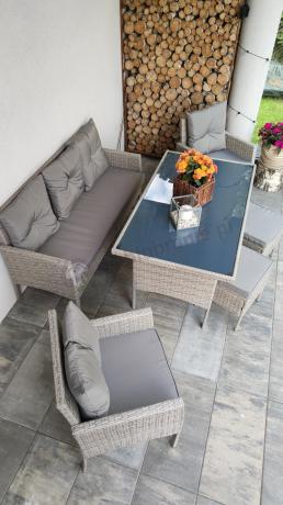 Szare meble ogrodowe technorattan ze stołem obiadowym i sofą Torino Dining