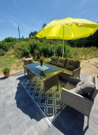 Szare meble ogrodowe technorattan ze stołem obiadowym i sofą Torino Dining