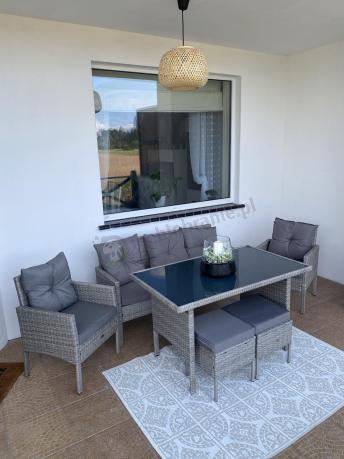 Szare meble ogrodowe technorattan ze stołem obiadowym i sofą Torino Dining