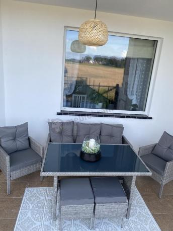 Szare meble ogrodowe technorattan ze stołem obiadowym i sofą Torino Dining