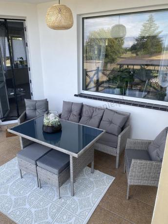 Szare meble ogrodowe technorattan ze stołem obiadowym i sofą Torino Dining