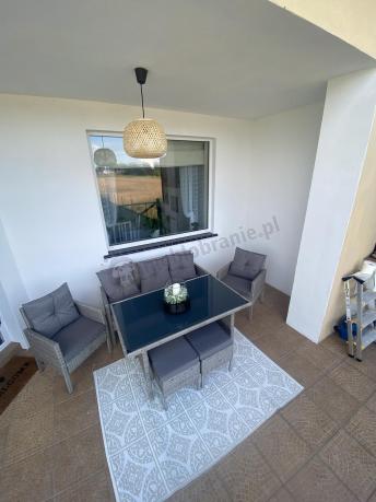 Szare meble ogrodowe technorattan ze stołem obiadowym i sofą Torino Dining