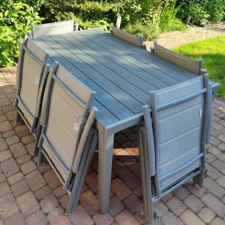 Szary komplet mebli ogrodowych ze stołem obiadowym i składanymi krzesłami - Kanbery Silver 6+1