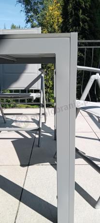 Szary komplet mebli ogrodowych ze stołem obiadowym i składanymi krzesłami - Kanbery Silver 6+1