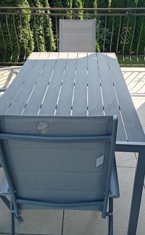 Szary komplet mebli ogrodowych ze stołem obiadowym i składanymi krzesłami - Kanbery Silver 6+1