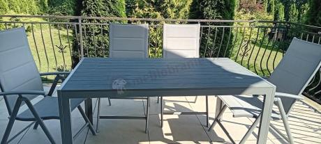 Szary komplet mebli ogrodowych ze stołem obiadowym i składanymi krzesłami - Kanbery Silver 6+1