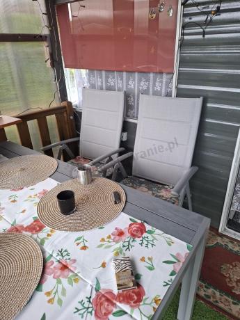 Szary komplet mebli ogrodowych ze stołem obiadowym i składanymi krzesłami - Kanbery Silver 6+1