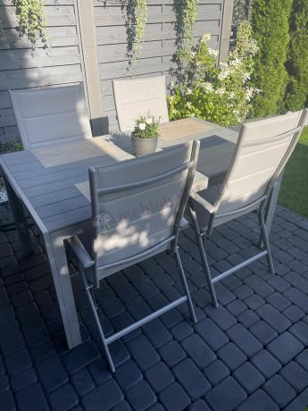 Szary komplet mebli ogrodowych ze stołem obiadowym i składanymi krzesłami - Kanbery Silver 6+1