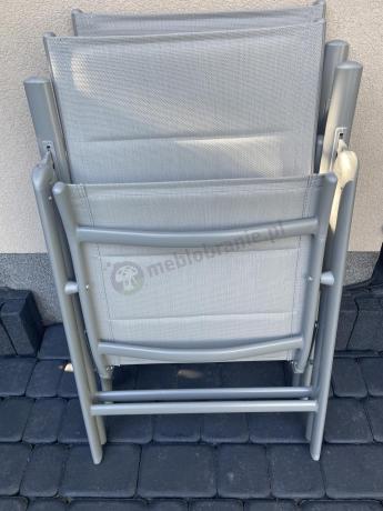 Szary komplet mebli ogrodowych ze stołem obiadowym i składanymi krzesłami - Kanbery Silver 6+1