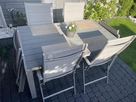 Szary komplet mebli ogrodowych ze stołem obiadowym i składanymi krzesłami - Kanbery Silver 6+1