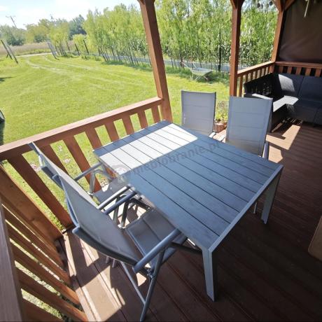 Szary komplet mebli ogrodowych ze stołem obiadowym i składanymi krzesłami - Kanbery Silver 6+1