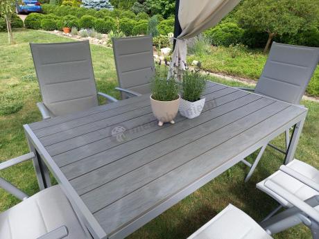 Szary komplet mebli ogrodowych ze stołem obiadowym i składanymi krzesłami - Kanbery Silver 6+1