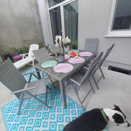 Szary komplet mebli ogrodowych ze stołem obiadowym i składanymi krzesłami - Kanbery Silver 6+1