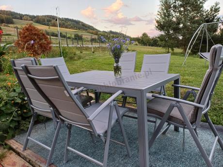 Szary komplet mebli ogrodowych ze stołem obiadowym i składanymi krzesłami - Kanbery Silver 6+1