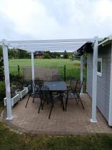 Aranżacja: Biała pergola na taras z materiałowym dachem Kirn 3x3 - Grey White
