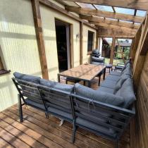 Aranżacja: Duży narożnik ogrodowy metalowy 294x184cm Doros Corner XXL z 2 fotelami, 2 pufami i stołem 160cm - Polywood Dark Grey