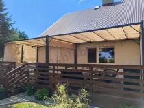 Aranżacja: Kremowa pergola tarasowa z roletami Simi 3x4m