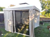 Aranżacja: Mocny pawilon ogrodowy 3x3 metalowy z zasłonami i moskitierą Okapi Max Kremowy
