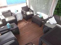 Brązowe meble ogrodowe technorattan Corfu pod altaną