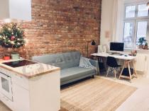 Elegancka sofa rozkładana w stylu skandynawskim Actona Leconi