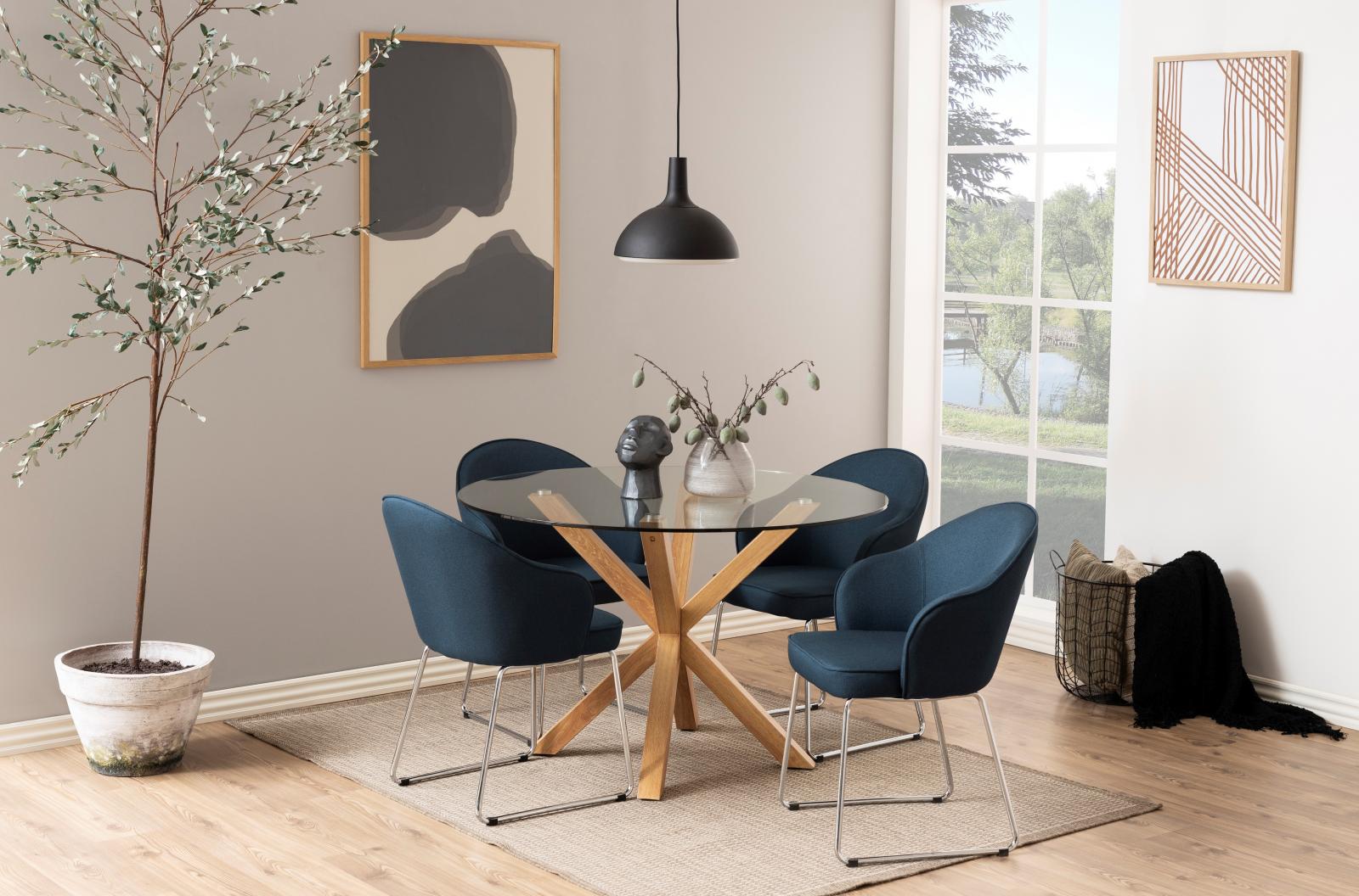 Okrągły stół ze szklanym blatem do salonu - aranżacja