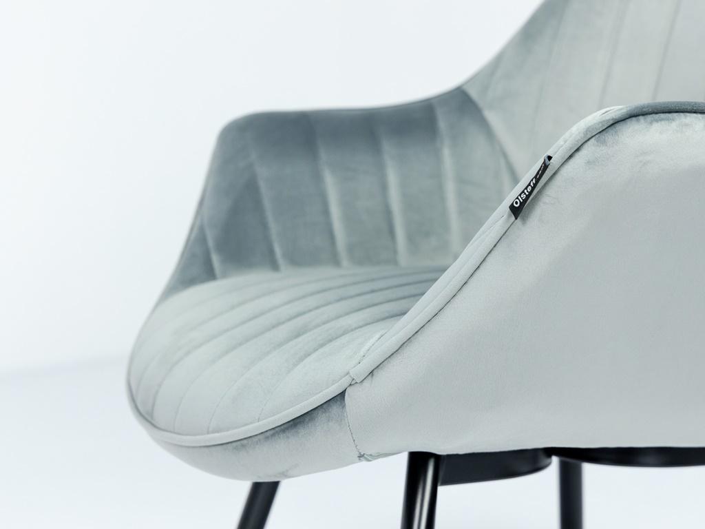 szare krzesło welurowe na czarnych nogach