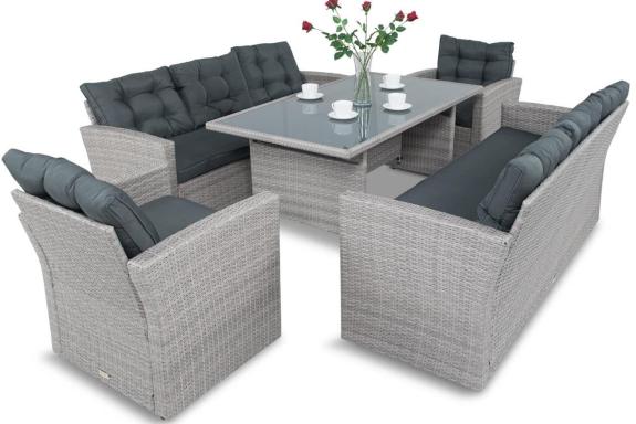 Meble ogrodowe z dwoma kanapami i stołem obiadowym