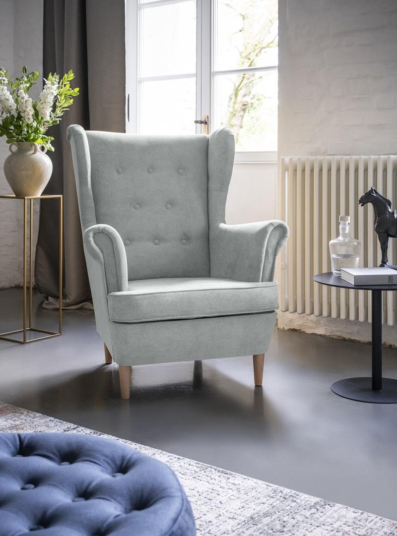 szary wygodny fotel uszak do salonu 