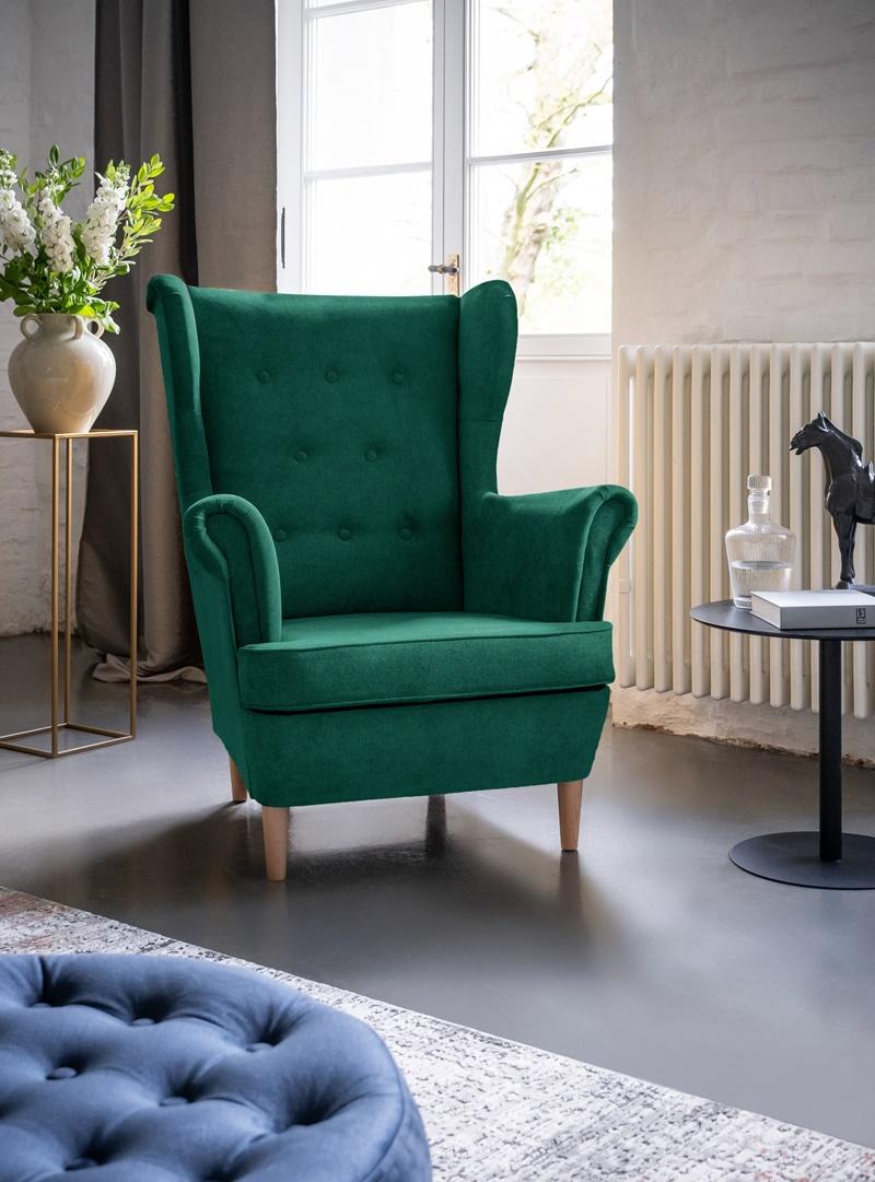 zielony wygodny fotel uszak do salonu